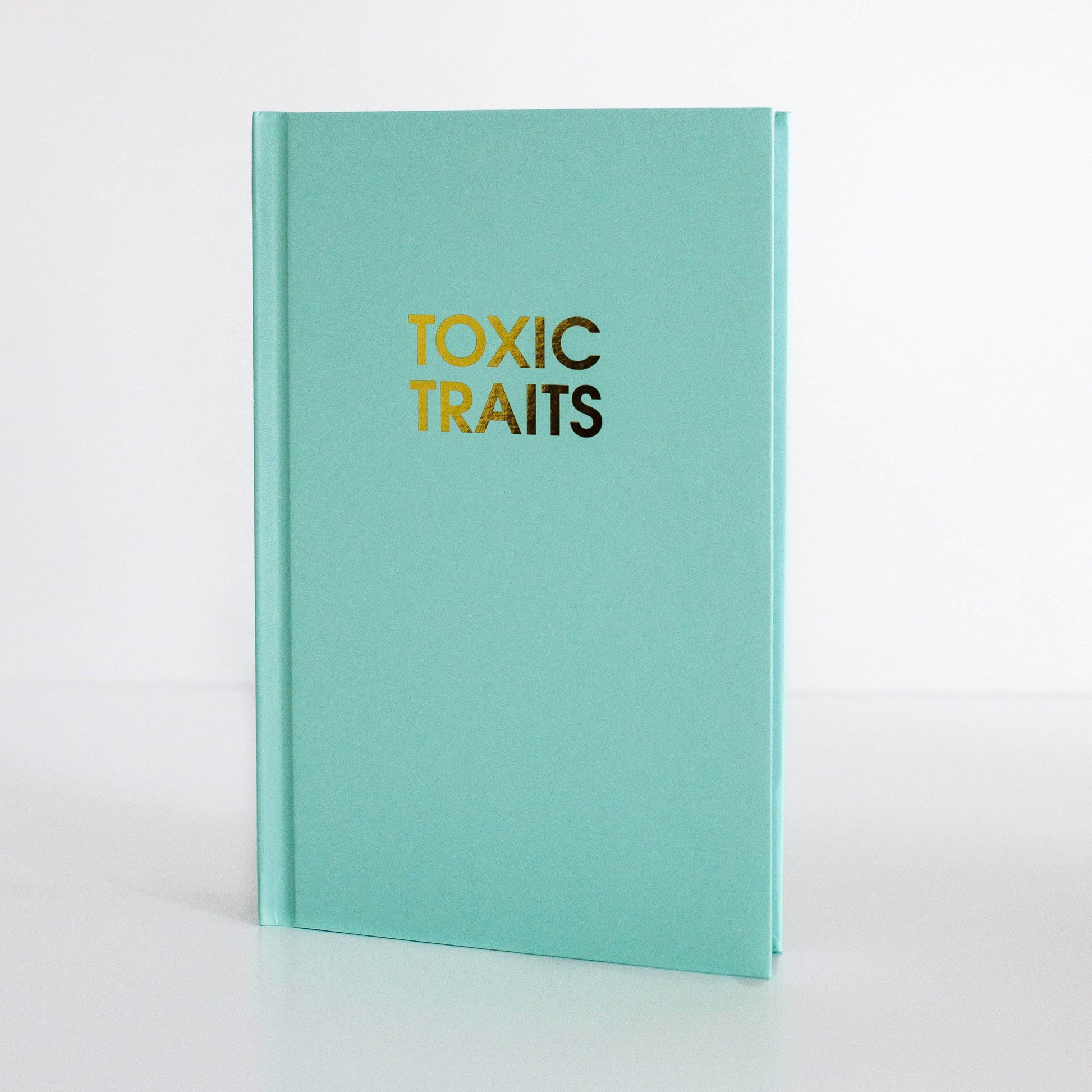 Toxic Traits bright green journal with gold foil print for guided journaling, journal prompts, and journaling supplies.