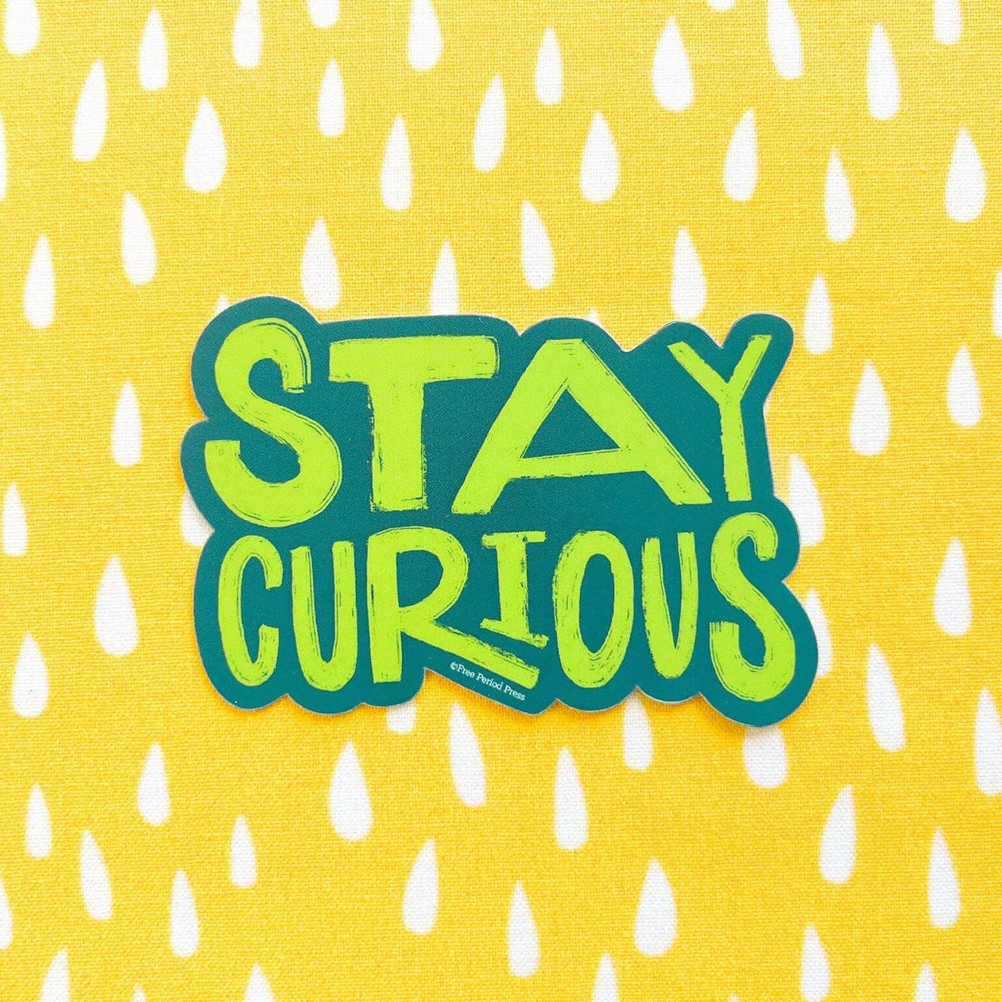 Stay Curious vinyl decal sticker on yellow and white dotted background, perfect for journaling or decorating laptops and water bottles.