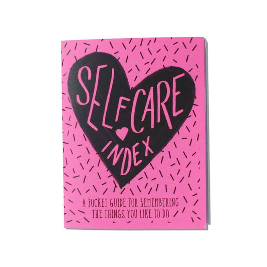 Pink Self Care Index Zine cover with black heart and text, promoting journaling, guided journaling, and journal prompts for self-care.