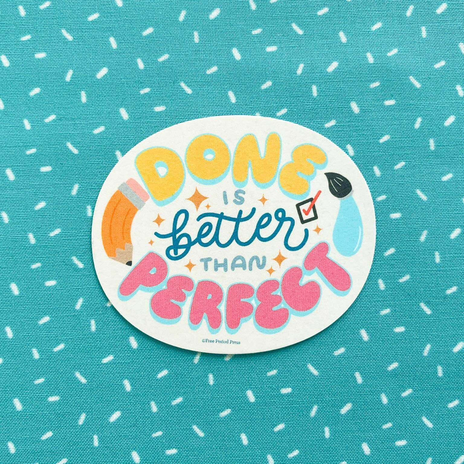 Done is Better Than Perfect vinyl decal sticker on a dotted teal background for journaling, laptop, and water bottle decoration.