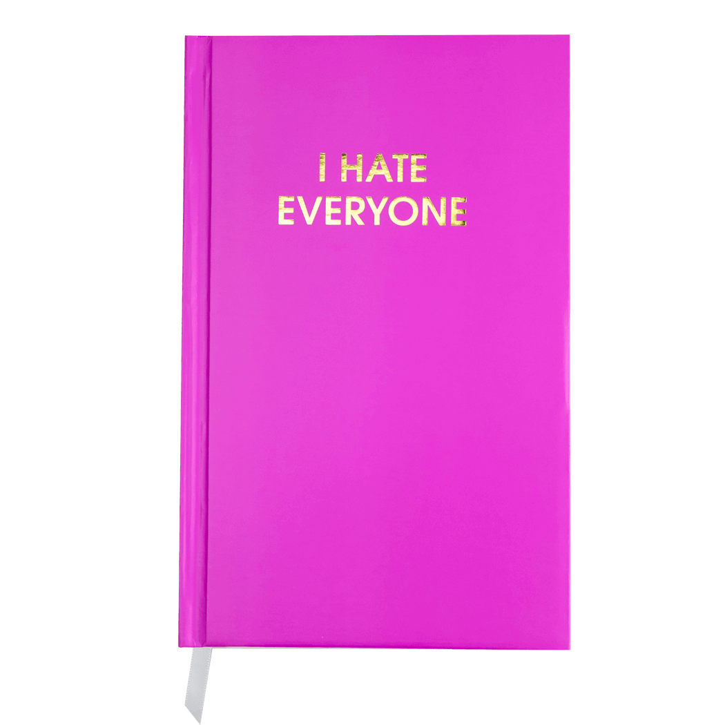 Bright pink "I Hate Everyone" journal with gold foil printing and white page marking ribbon for guided journaling.