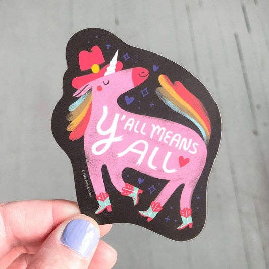 Vibrant vinyl sticker of a rainbow unicorn in a cowboy hat and boots, with "Y'all Means All" text. Perfect for laptops, water bottles, and journaling.