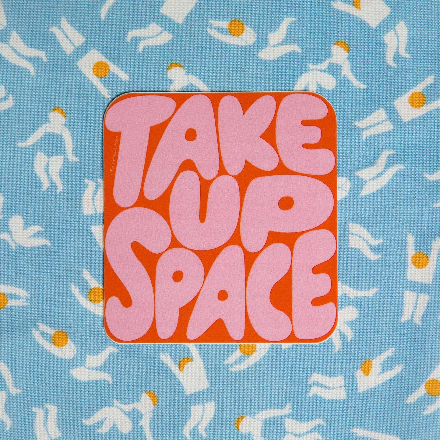 "Take Up Space Vinyl Decal Sticker on blue patterned background. Perfect for adding personality to journals, laptops, and water bottles."