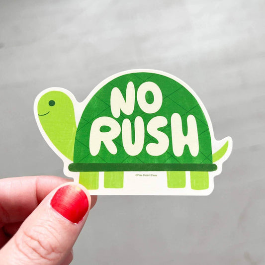 Hand holding a No Rush Turtle Vinyl Decal Sticker, great for journaling, journal prompts, guided journaling, and journal supplies.