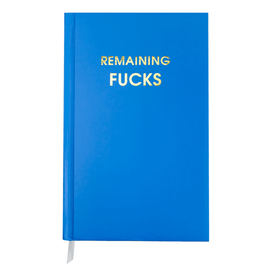 Bright blue hardcover journal with gold foil text "Remaining Fucks," 256 lined pages, and a white ribbon bookmark for journaling