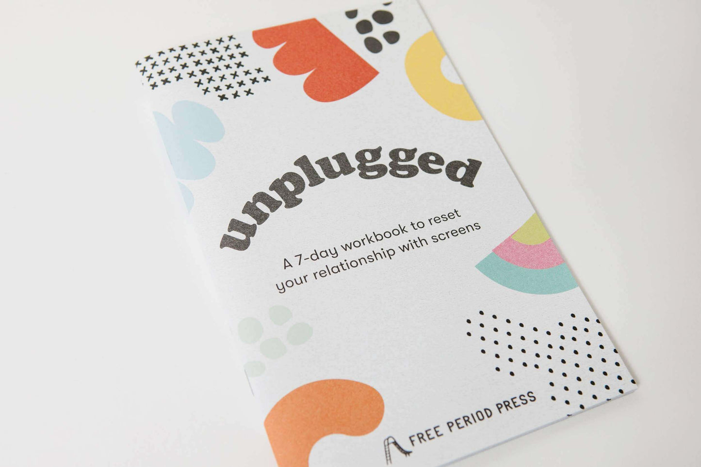 Unplugged workbook cover with vibrant design, promoting guided journaling to reset your relationship with screens.