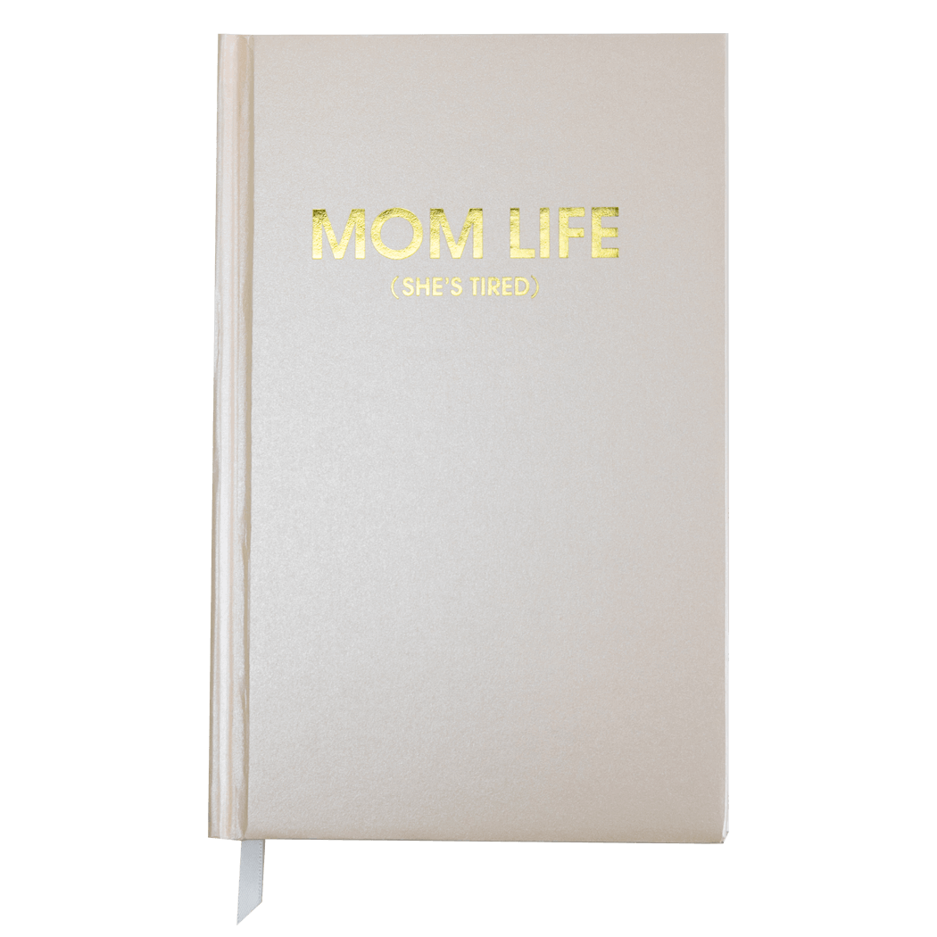 Coral sparkle hardback "Mom Life (She's Tired)" journal with gold foil printing, 256 ruled sheets, and white page tracking ribbon.