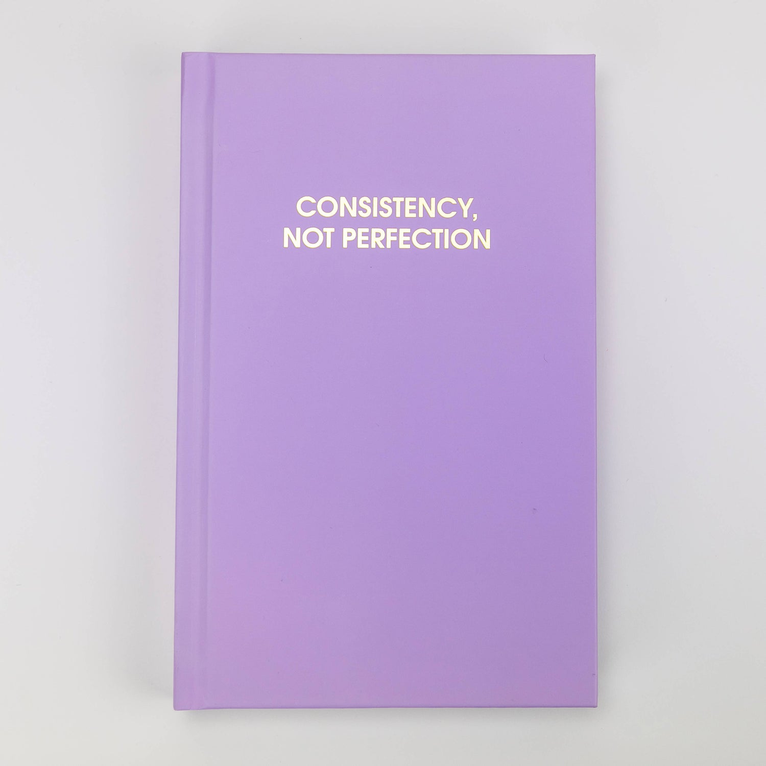 Bright Neon Amethyst 'Consistency Not Perfection' journal with gold foil printing, perfect for guided journaling and journal prompts.