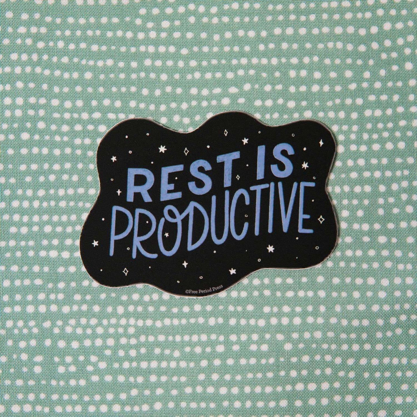 "Rest is Productive" vinyl decal sticker on green dotted background, perfect for journaling, journal prompts, and guided journaling supplies.