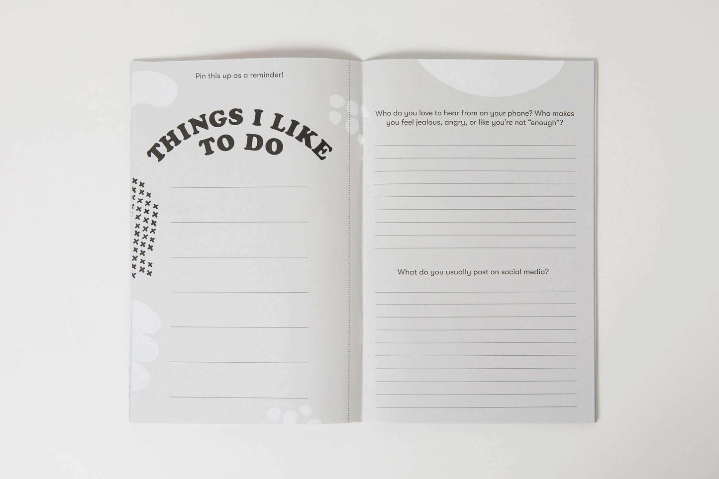 Unplugged workbook open to journal prompts for reflecting on screen habits and identifying favorite activities.