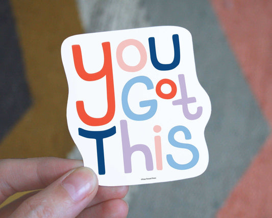 Cheerful "You Got This" vinyl decal sticker being held, perfect for journals, laptops, and water bottles to inspire and personalize your space.