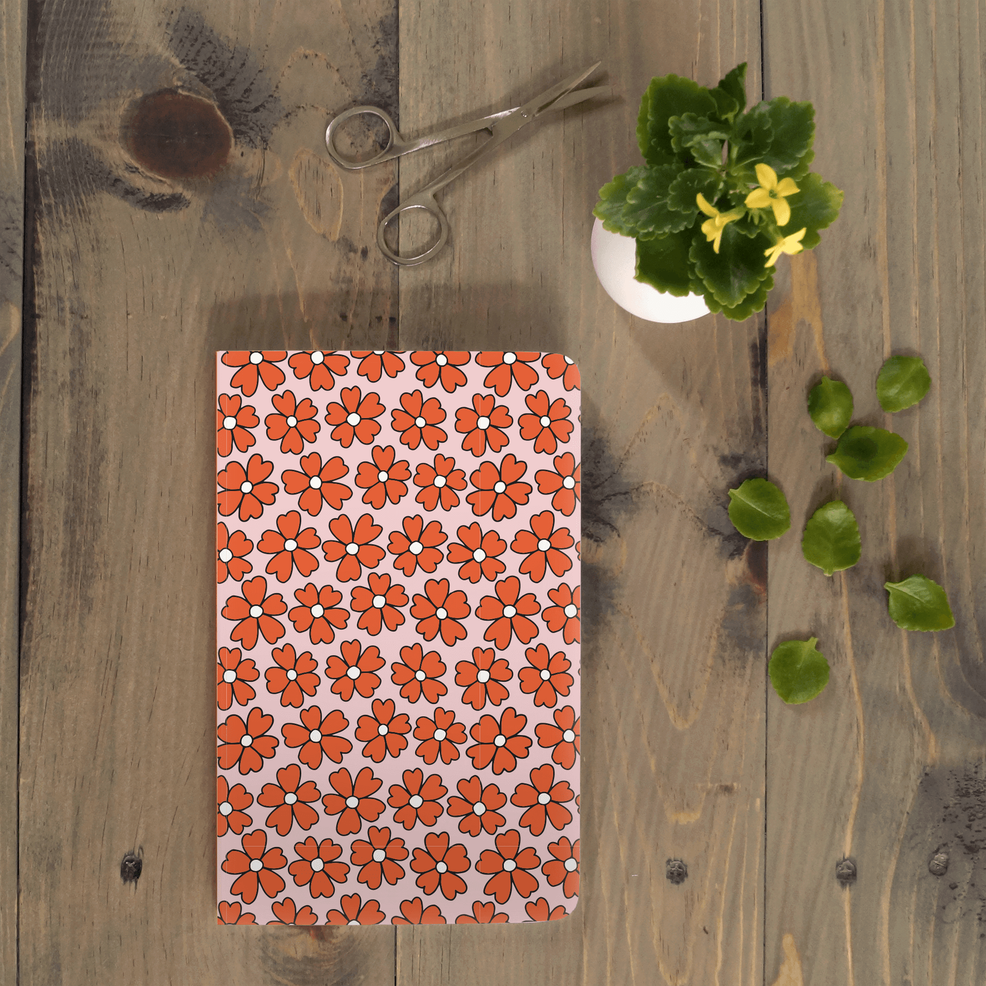 Miss Daisy Classic Layflat Journal Notebook with floral cover on rustic wooden table, perfect for journaling and guided journal prompts.