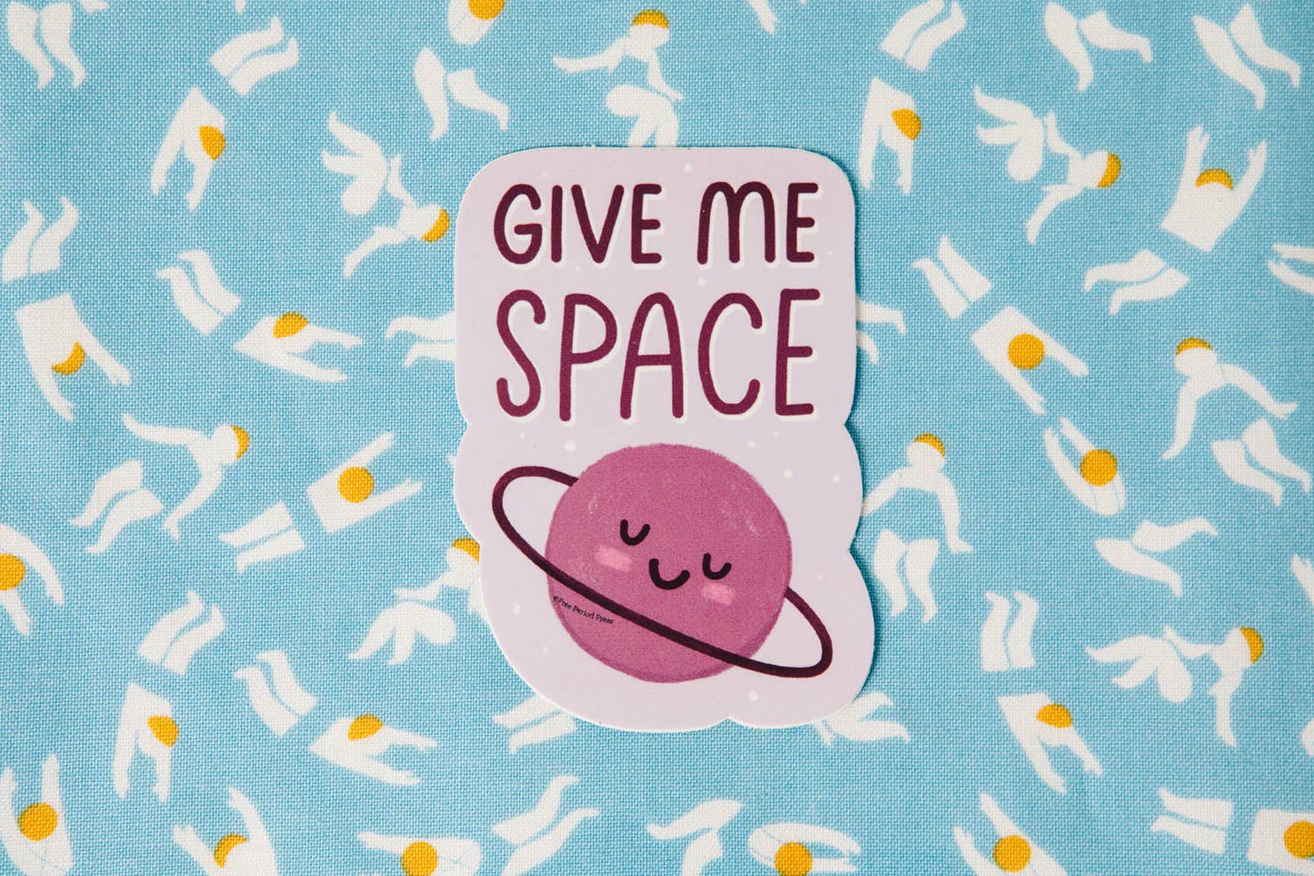 Cute "Give Me Space" vinyl decal sticker on patterned fabric, perfect for journaling supplies like laptops, planners, and cars.