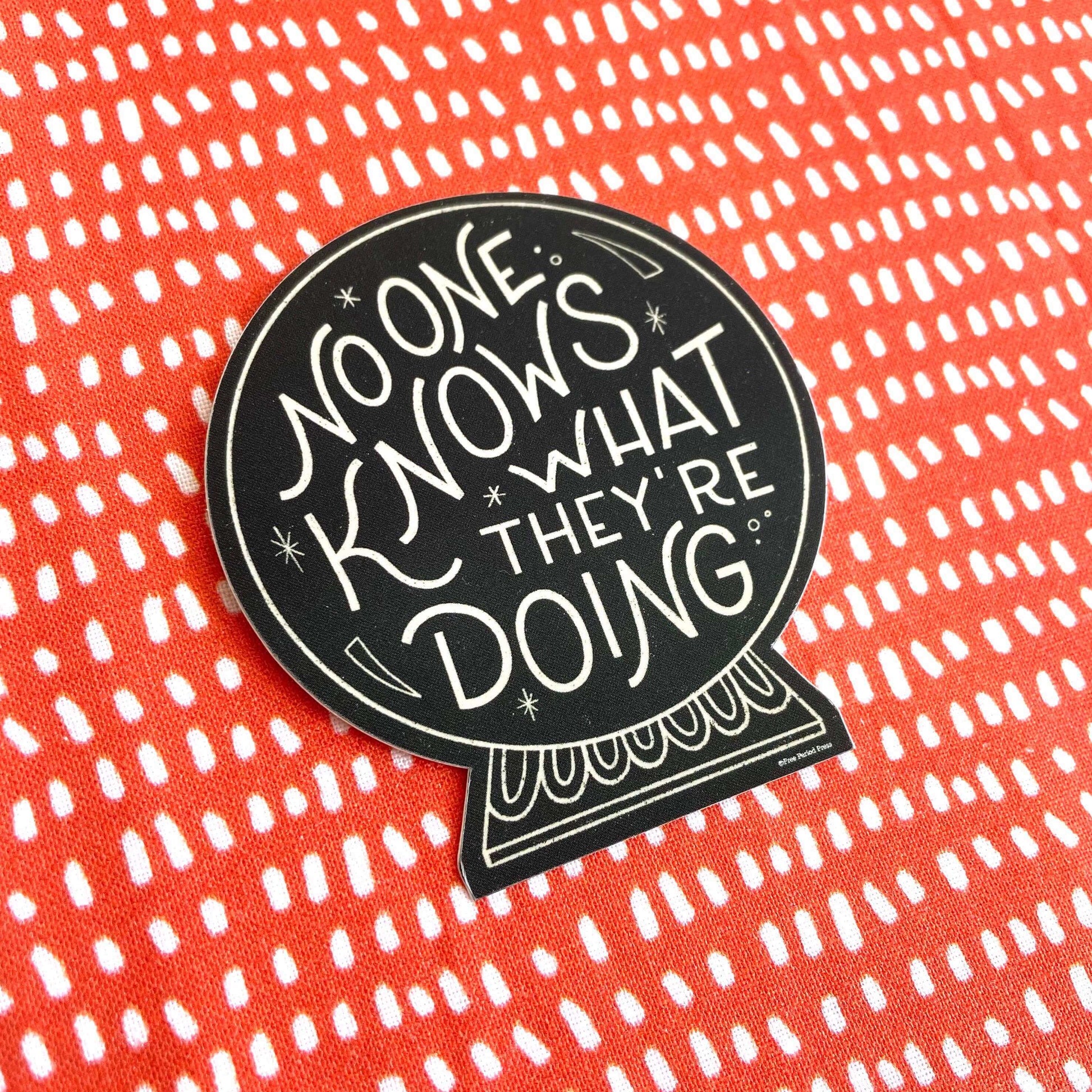 No One Knows What They're Doing vinyl decal sticker on a vibrant red and white dotted background, perfect for journaling accessories.