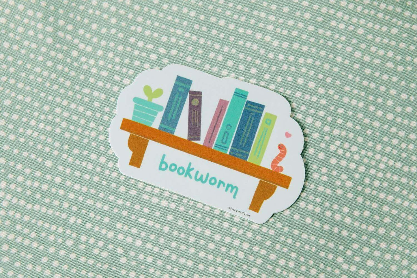 Bookworm vinyl decal sticker featuring books on a shelf with a cute worm, perfect for laptops, journals, water bottles, and more!