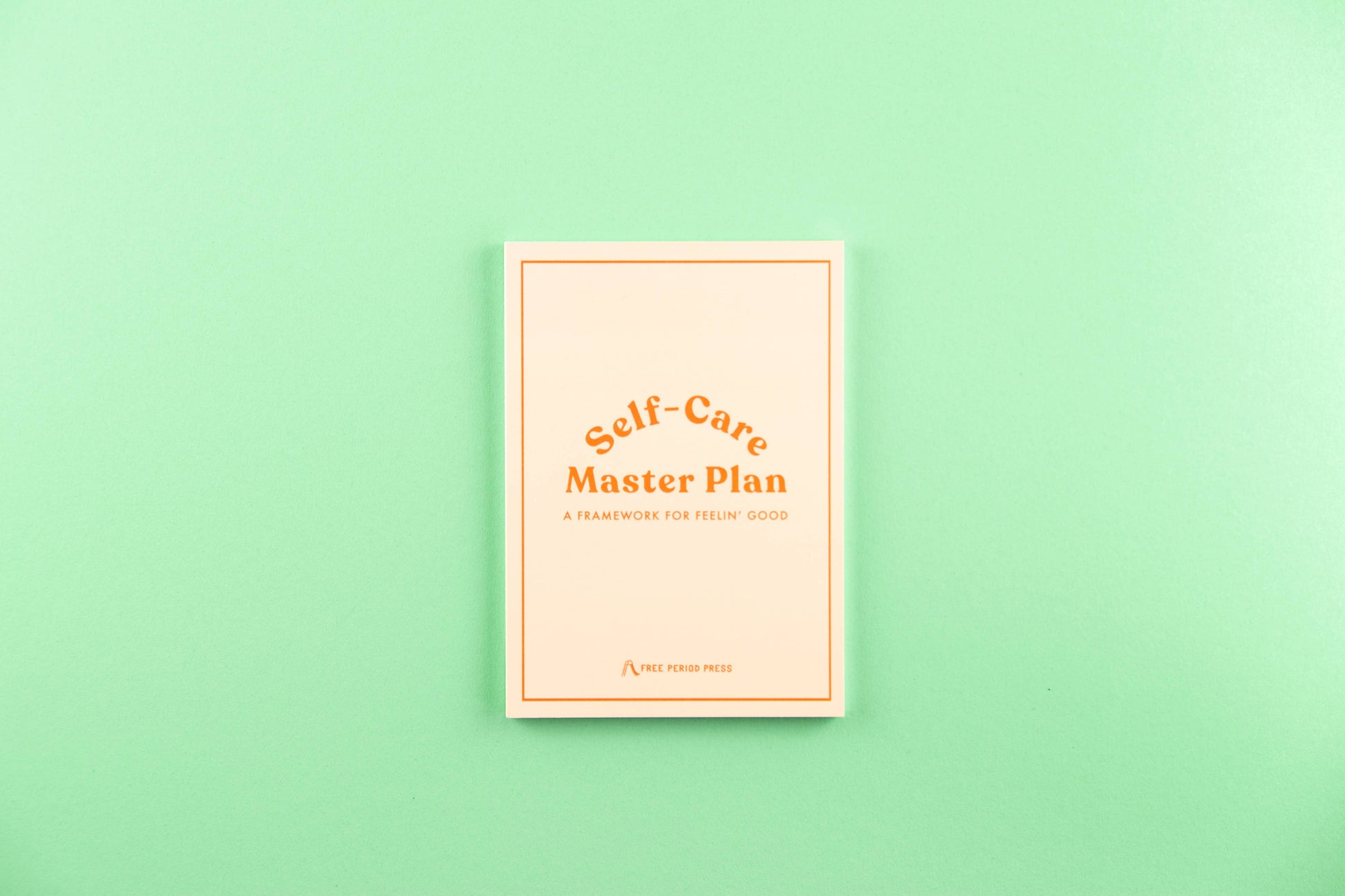 Self-Care Master Plan book on a mint green background for guided journaling and journal prompts.