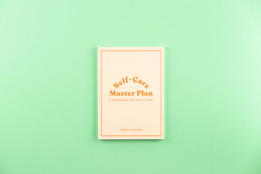 Self-Care Master Plan book on a mint green background for guided journaling and journal prompts.