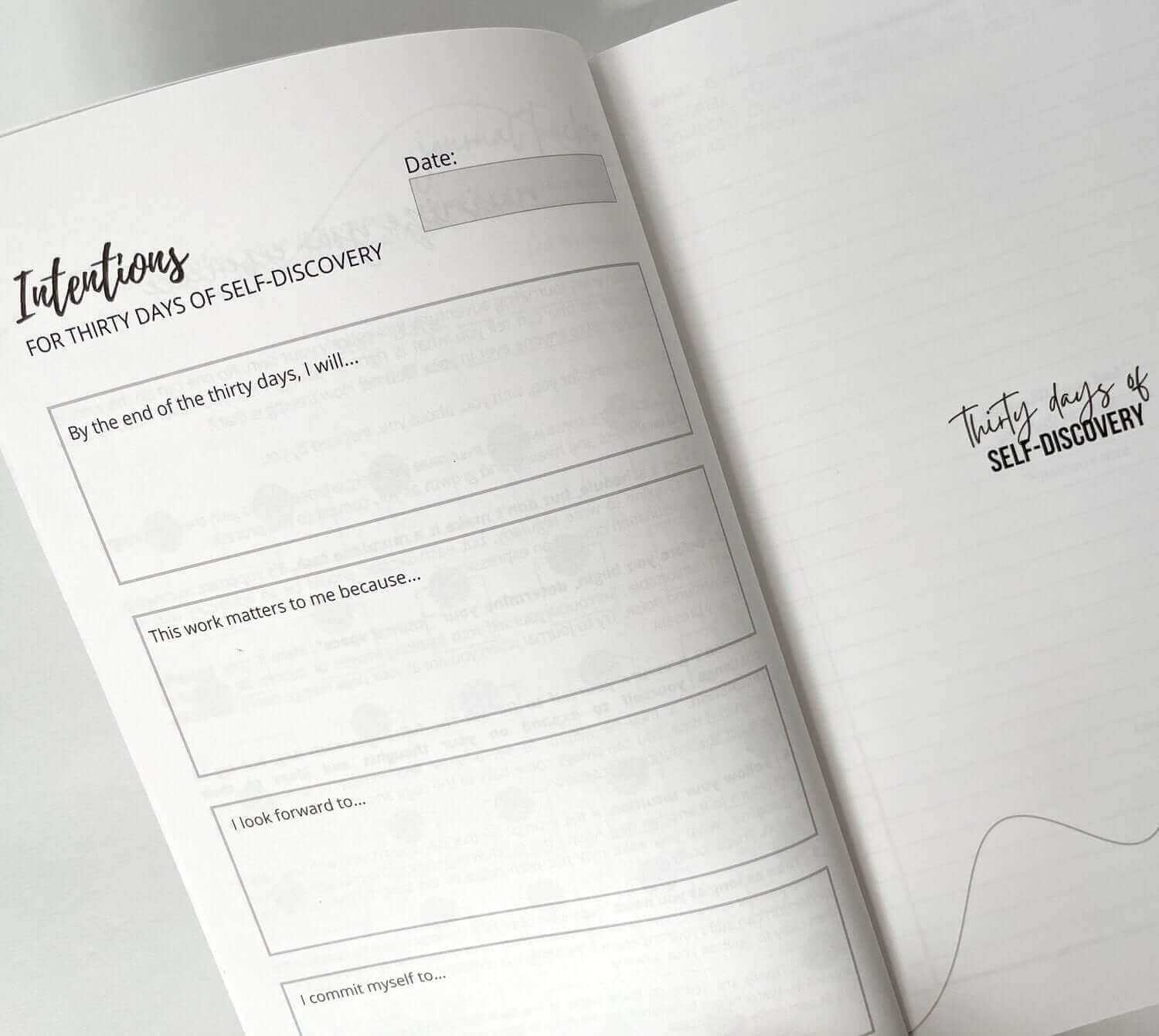 "Open journal from Thirty Days of Self-Discovery with intention setting prompts and blank pages for journaling your inner journey"