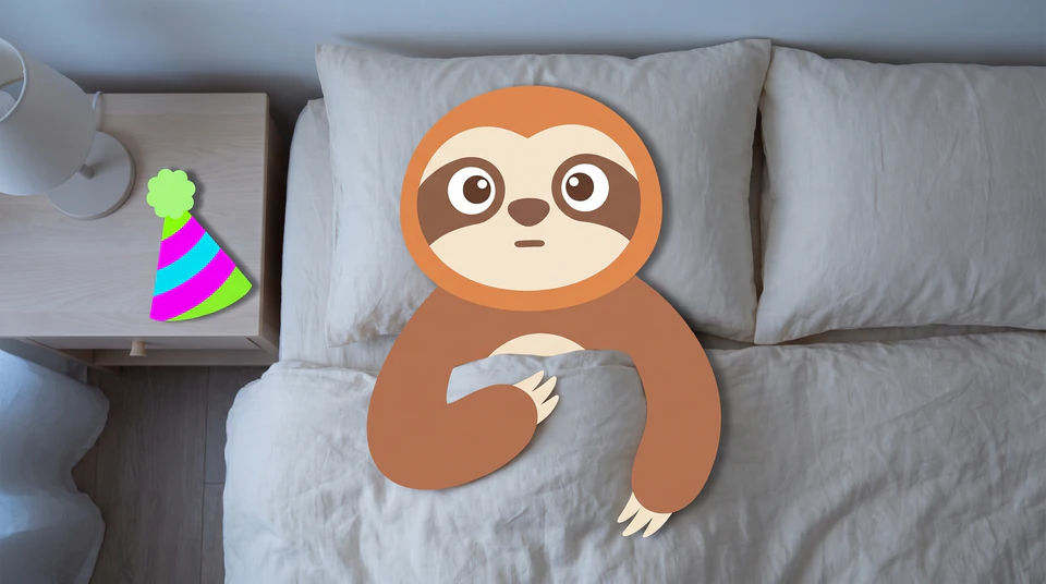 The Journal Party sloth lying wide awake in bed, a party hat on the nightstand.